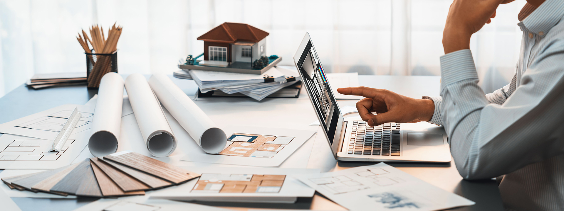Interior architect designer at table with architecture software. Insight
